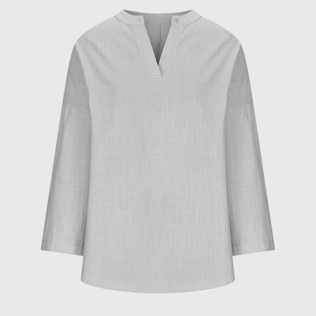 Camisa femenina sin mangas fluida con botones casual