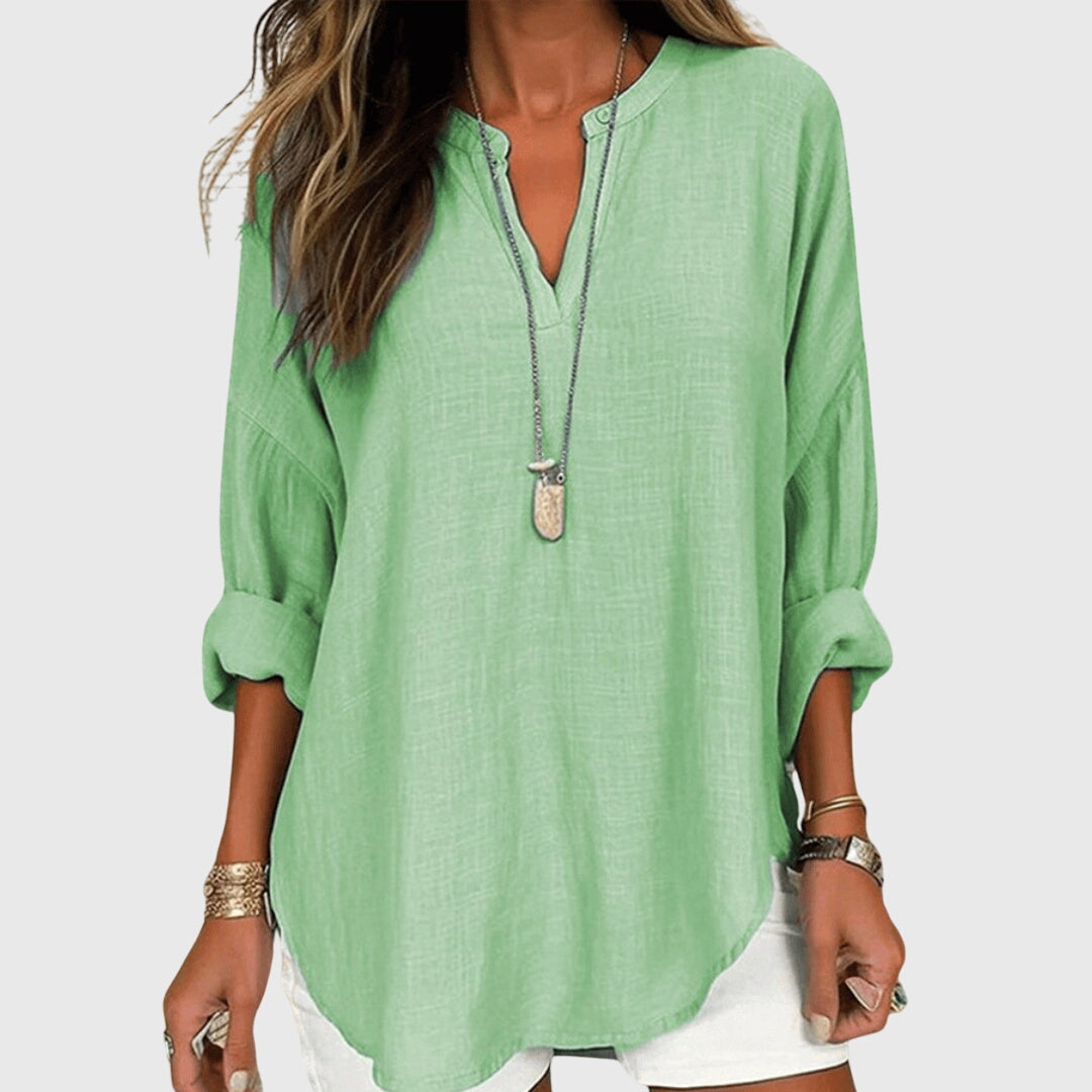Camisa femenina sin mangas fluida con botones casual