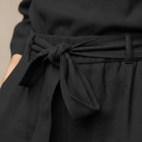 Ensemble deux pièces haut à manches longues ceinturé pantalon fuselé femme
