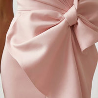 Robe midi femme sans manches à col rond avec nœud devant et coupe trapèze